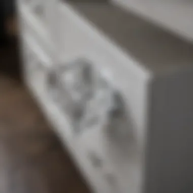 Installation of a crystal drawer pull on a modern cabinet