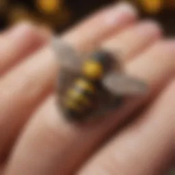 Close-up of a beautifully crafted bee nail charm adorned with intricate designs.