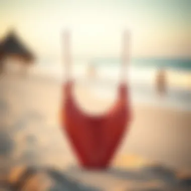 A fashionable high-waisted drawstring bikini set displayed on a sandy beach